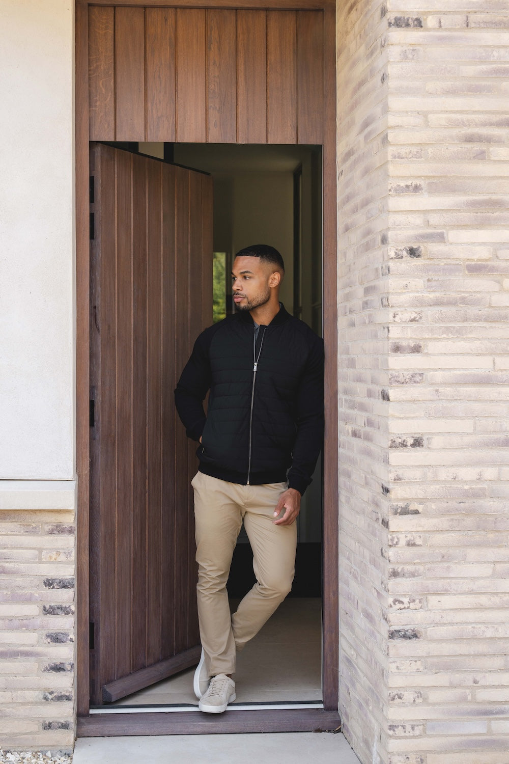 Quilted Hybrid Bomber Jacket in Black